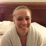 Desiree Capuano in her bathrobe, on her bed